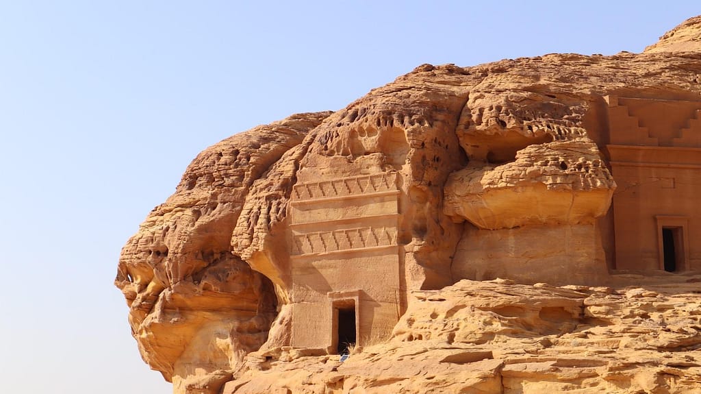 a building carved into the side of a mountain