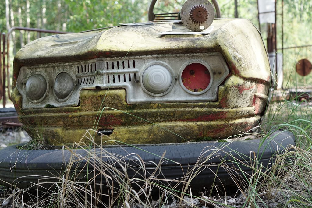 vintage brown car on green grass during daytime