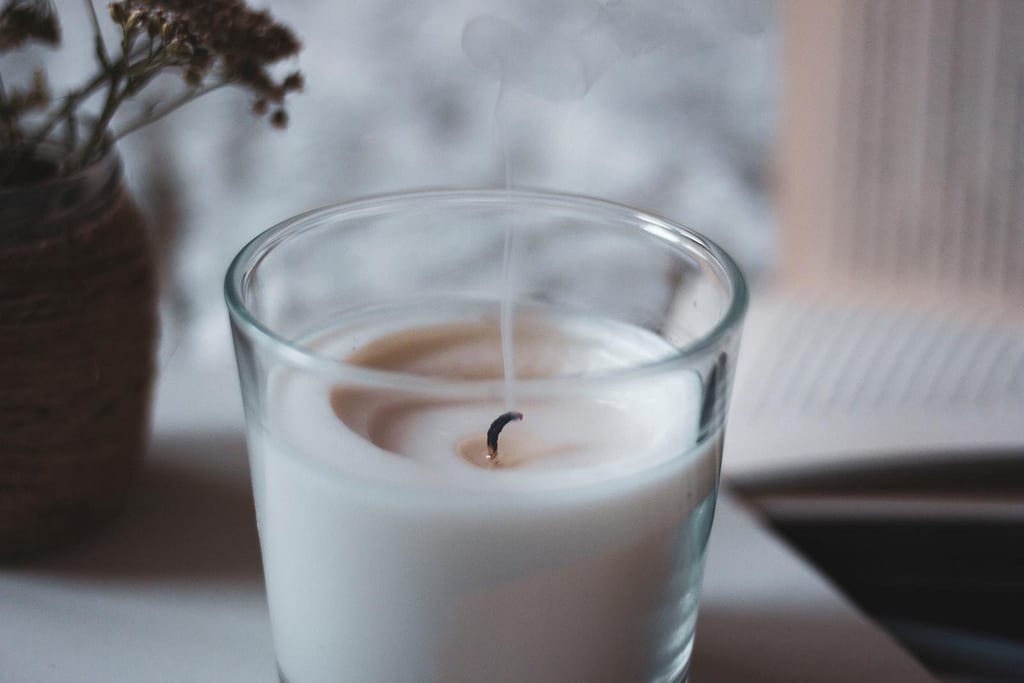 white liquid in clear drinking glass