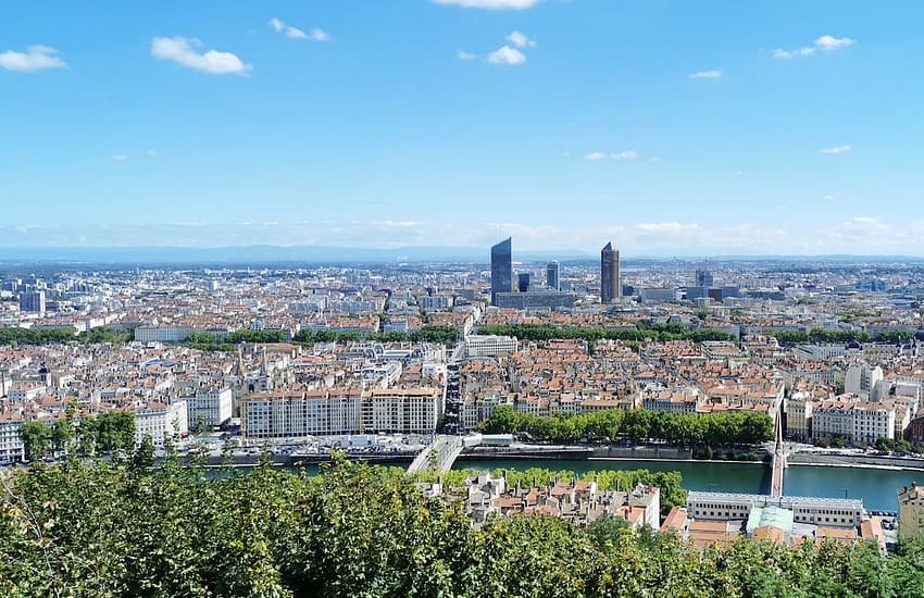 city buildings under blue sky during daytime